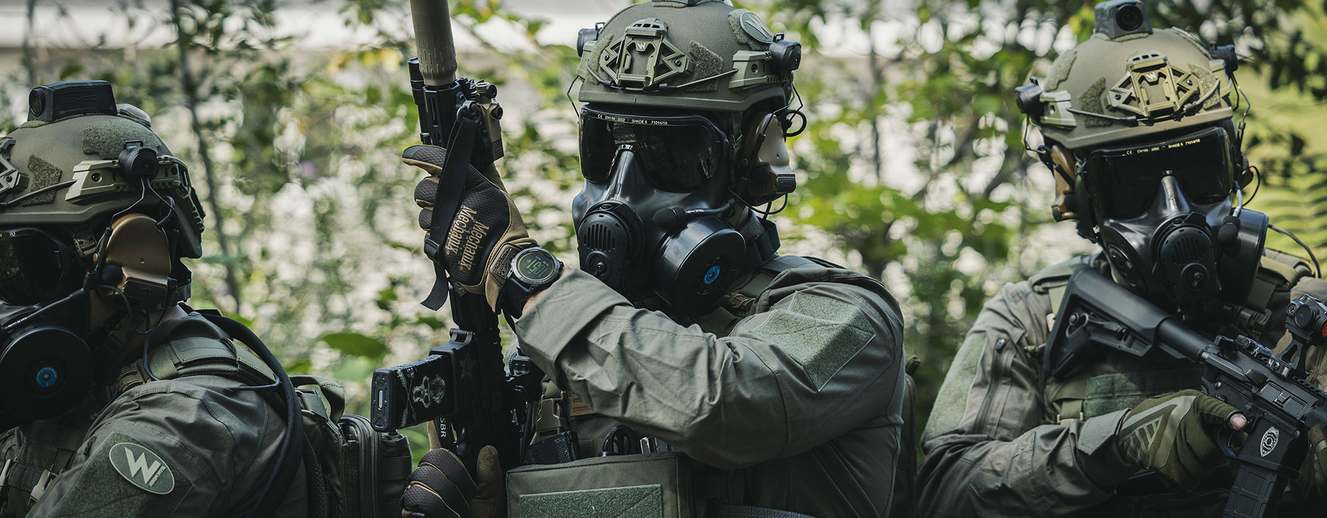 Soldiers wearing a helmet and respirator with firearms