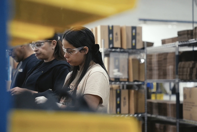 Employees working on a factory production line