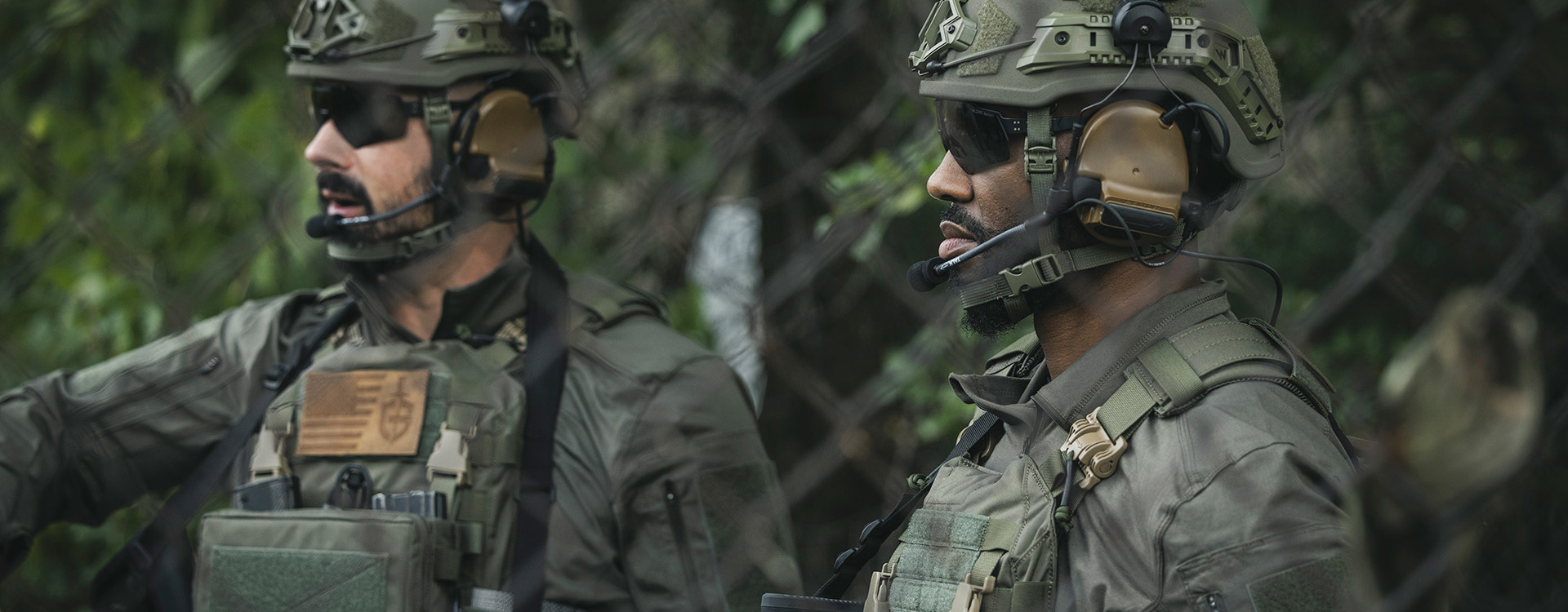Two soldiers in camouflage and helmets