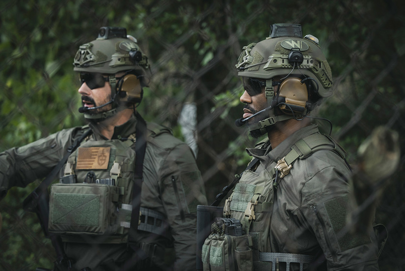 Two soldiers in camouflage and helmets