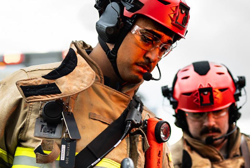 Firemen in protective gear and helmets