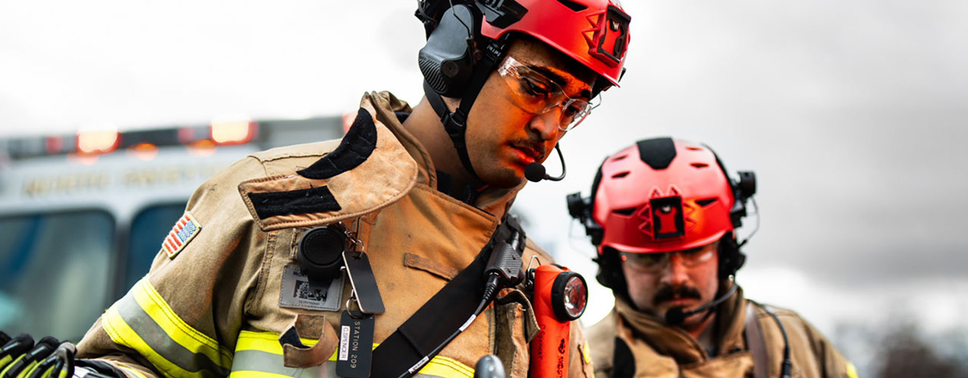 Firemen in protective gear and helmets