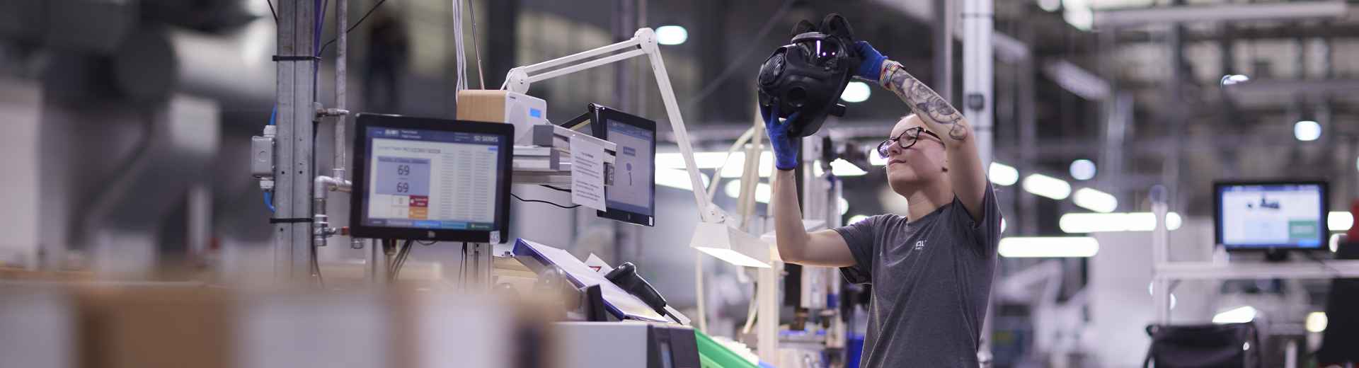 Two employees gathered around a screen